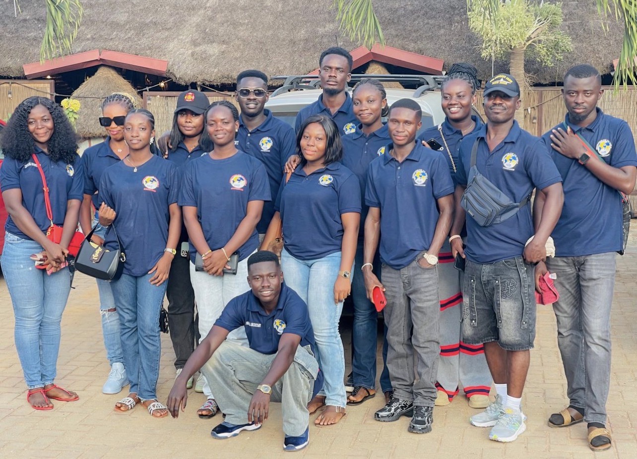 The IWF volunteer team in branded navy polo shirts