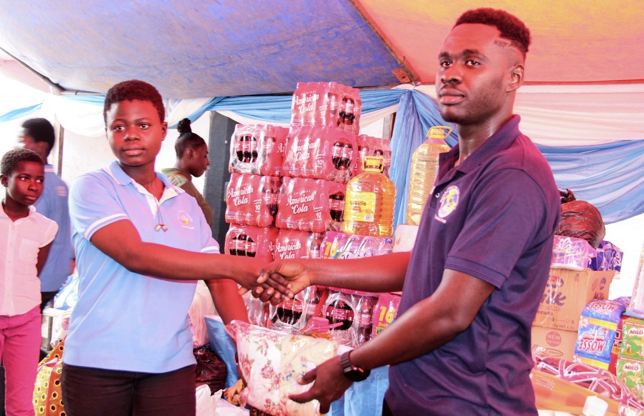 Handing over donated items to a beneficiary